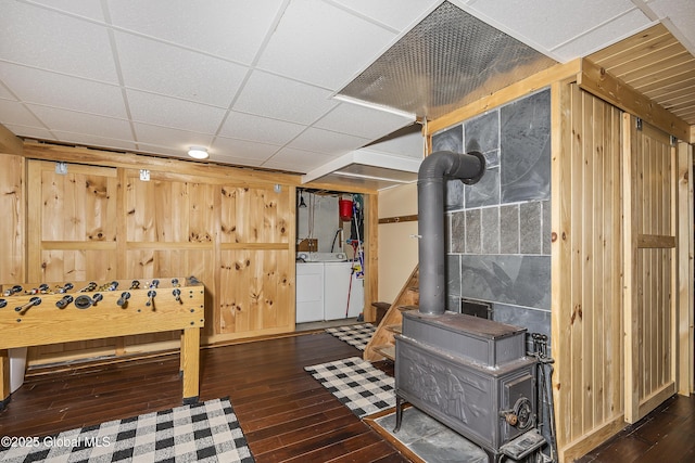 19 Knowles Rd, Rensselaerville, NY 12469 - rec room with independent washer and dryer, a wood stove, wood-type flooring, and wood walls