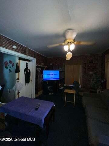 225 Main St, Fort Plain, NY 13339 - bedroom with brick wall and a ceiling fan