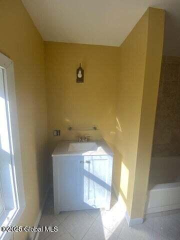225 Main St, Fort Plain, NY 13339 - laundry area featuring tile patterned flooring and baseboards