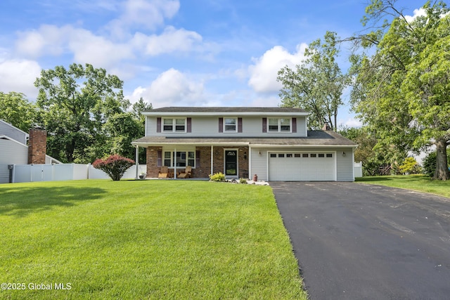 1908 Evva Dr, Guilderland, NY 12303 - traditional-style home featuring driveway, covered porch, and brick siding