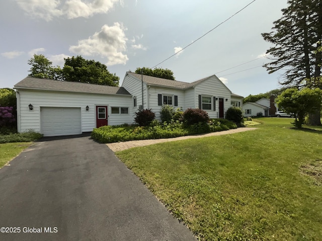 11 Calhoun Rd, Brunswick, NY 12180 - ranch-style house with an attached garage, a front lawn, asphalt driveway, and roof with shingles