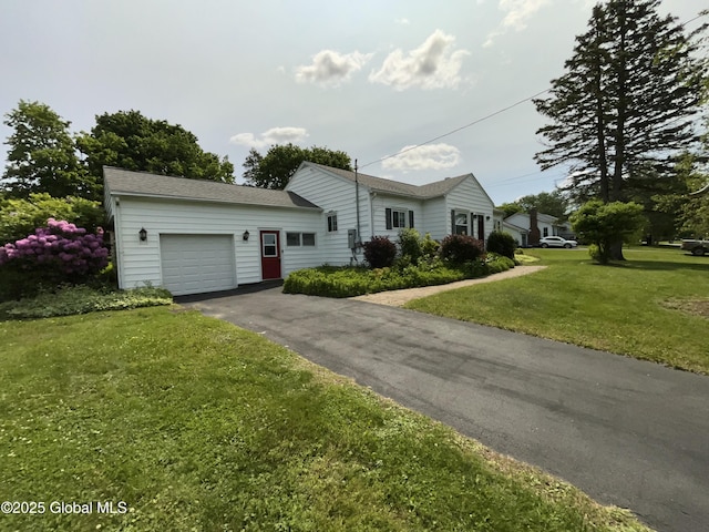 11 Calhoun Rd, Brunswick, NY 12180 - ranch-style home with driveway, a garage, and a front yard