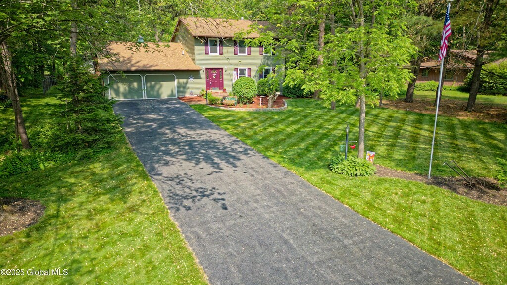 2 Clifton Pines Drive # Pvt, Clifton Park, NY 12065 - view of front of property with asphalt driveway, a garage, and a front lawn
