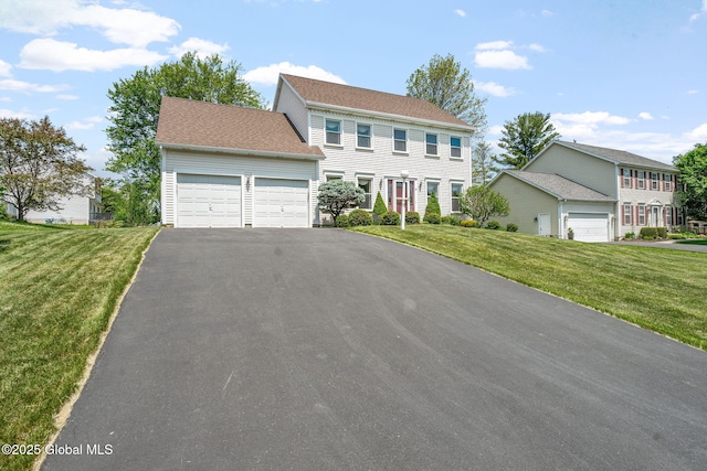 19 Runnel Dr, Colonie, NY 12304 - colonial home featuring a garage, driveway, and a front yard