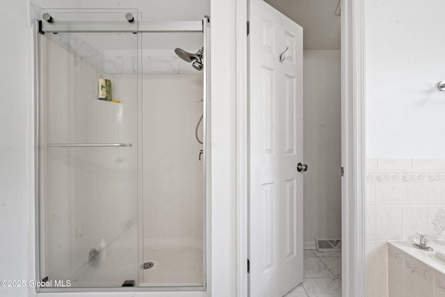 19 Runnel Dr, Colonie, NY 12304 - bathroom with a shower stall, marble look tile flooring, and tiled tub