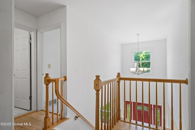 19 Runnel Dr, Colonie, NY 12304 - stairway with a chandelier and wood finished floors
