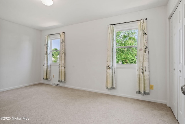 19 Runnel Dr, Colonie, NY 12304 - carpeted empty room with baseboards