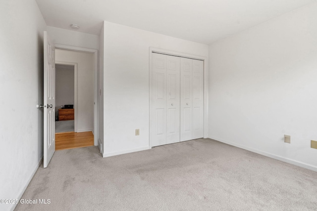 19 Runnel Dr, Colonie, NY 12304 - unfurnished bedroom with carpet, a closet, and baseboards