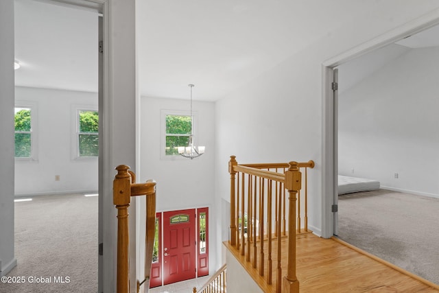 19 Runnel Dr, Colonie, NY 12304 - hall with an upstairs landing, carpet flooring, a chandelier, and baseboards