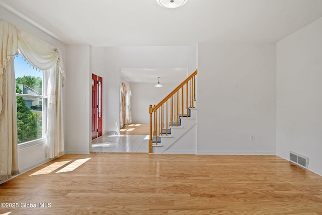 19 Runnel Dr, Colonie, NY 12304 - foyer with wood finished floors, stairway, and baseboards