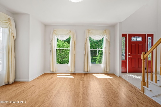 19 Runnel Dr, Colonie, NY 12304 - foyer with light wood-type flooring, baseboards, and stairway