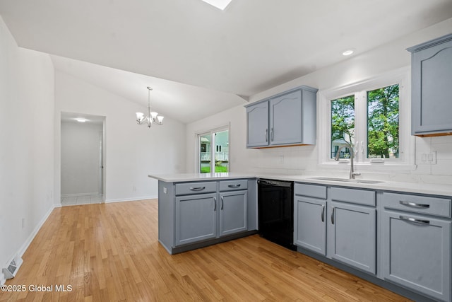19 Runnel Dr, Colonie, NY 12304 - kitchen with dishwasher, a sink, a peninsula, gray cabinetry, and vaulted ceiling