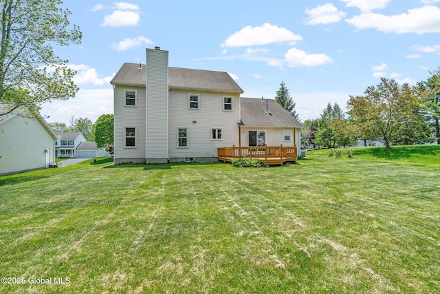 19 Runnel Dr, Colonie, NY 12304 - back of house with a chimney, a deck, and a yard