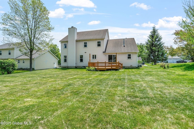 19 Runnel Dr, Colonie, NY 12304 - back of property with a chimney, a deck, a yard, and roof with shingles