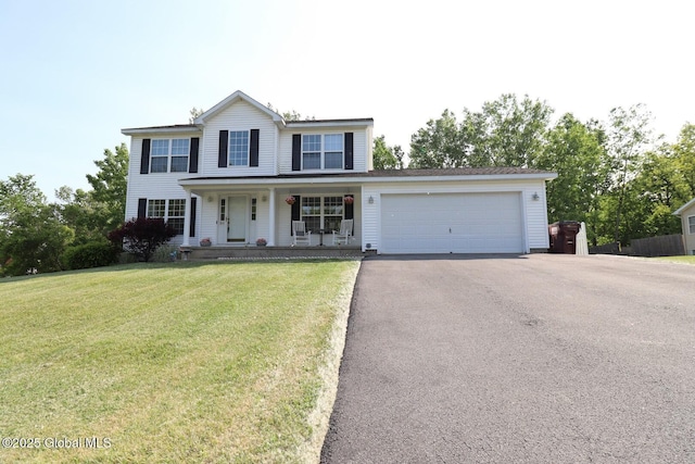 30 Battery Blvd, Stillwater, NY 12118 - view of front of property featuring covered porch, asphalt driveway, a garage, and a front lawn