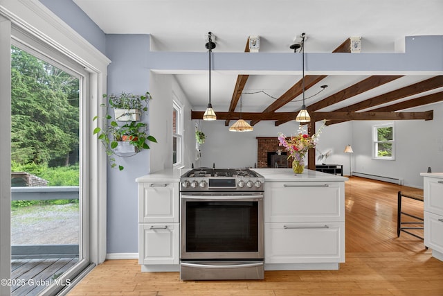 21 Hemlock Dr, Greenfield, NY 12833 - kitchen featuring gas range, a baseboard heating unit, light countertops, white cabinets, and beam ceiling
