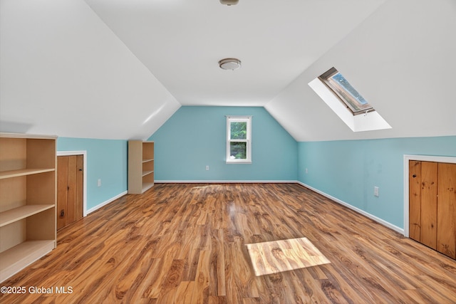 21 Hemlock Dr, Greenfield, NY 12833 - additional living space with a skylight, wood finished floors, and vaulted ceiling