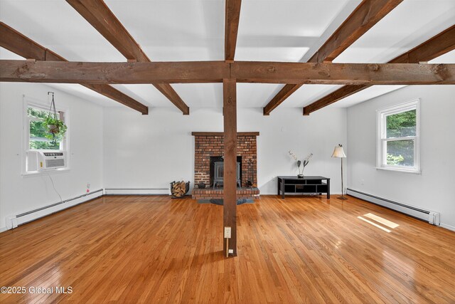 21 Hemlock Dr, Greenfield, NY 12833 - unfurnished living room with baseboard heating, wood-type flooring, a baseboard radiator, and beamed ceiling