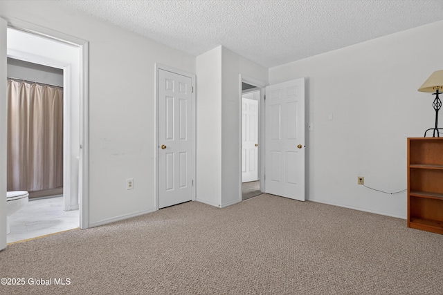 21 Hemlock Dr, Greenfield, NY 12833 - unfurnished bedroom with carpet floors, a textured ceiling, and connected bathroom