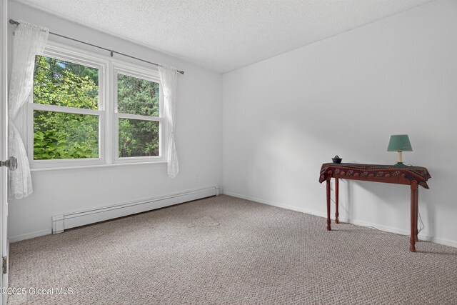 21 Hemlock Dr, Greenfield, NY 12833 - carpeted spare room with a baseboard radiator and a textured ceiling