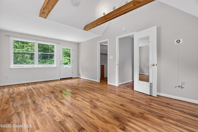 21 Hemlock Dr, Greenfield, NY 12833 - unfurnished bedroom with multiple windows, wood finished floors, and a walk in closet