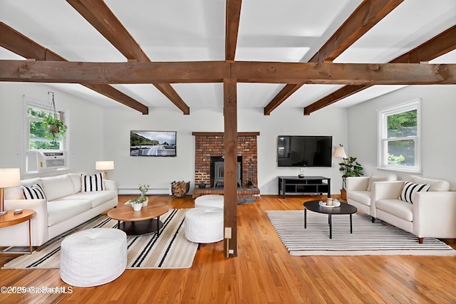 21 Hemlock Dr, Greenfield, NY 12833 - living room with wood finished floors, beamed ceiling, and a baseboard heating unit