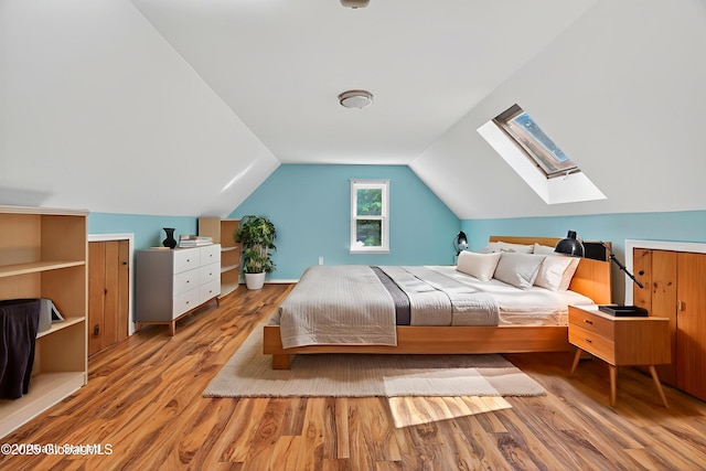 21 Hemlock Dr, Greenfield, NY 12833 - bedroom featuring a skylight, wood finished floors, and vaulted ceiling