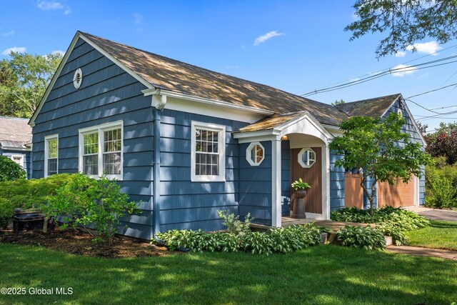 38 Horicon Ave, Glens Falls, NY 12801 - view of front facade with a front lawn and roof with shingles