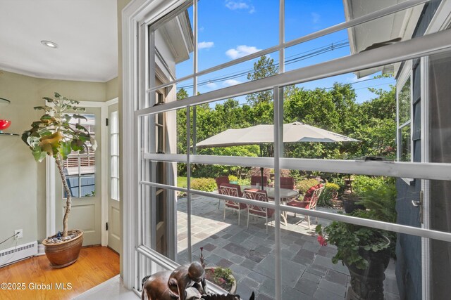 38 Horicon Ave, Glens Falls, NY 12801 - sunroom / solarium featuring a baseboard radiator and plenty of natural light
