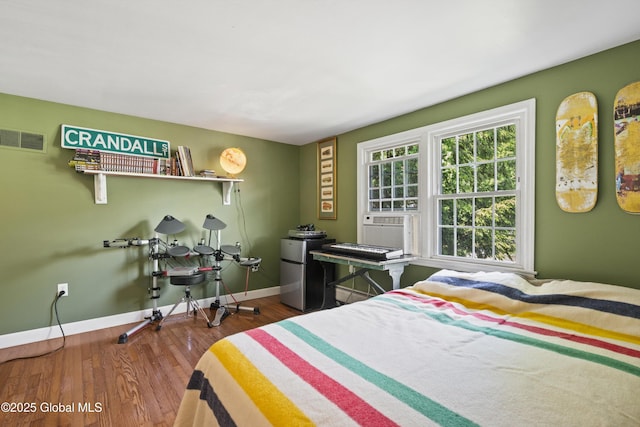 38 Horicon Ave, Glens Falls, NY 12801 - bedroom with wood finished floors and cooling unit