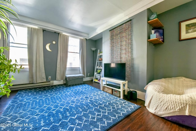 140 3rd St, Troy, NY 12180 - living area with baseboard heating, wood finished floors, and baseboards