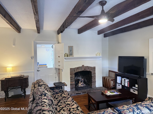 304 Green St, Schenectady, NY 12305 - living room with wood finished floors, beam ceiling, a ceiling fan, and a fireplace