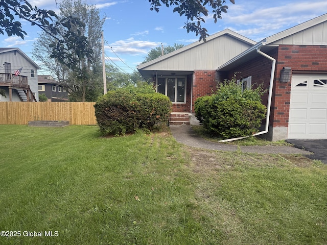63 Ormond St, Albany, NY 12203 - view of front of home featuring brick siding and a garage