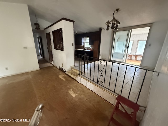 63 Ormond St, Albany, NY 12203 - unfurnished dining area with a chandelier and baseboards