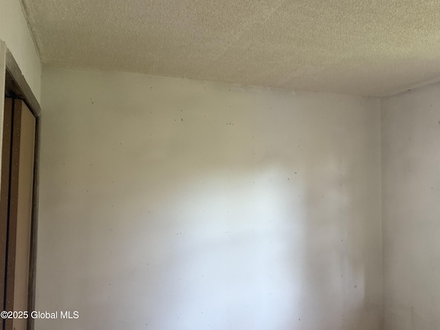 63 Ormond St, Albany, NY 12203 - empty room with a textured ceiling
