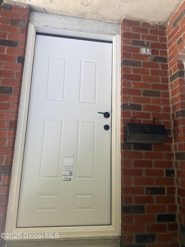 63 Ormond St, Albany, NY 12203 - property entrance featuring brick siding