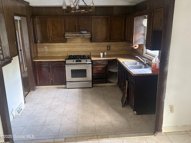 63 Ormond St, Albany, NY 12203 - kitchen with gas range, a sink, extractor fan, light countertops, and a chandelier