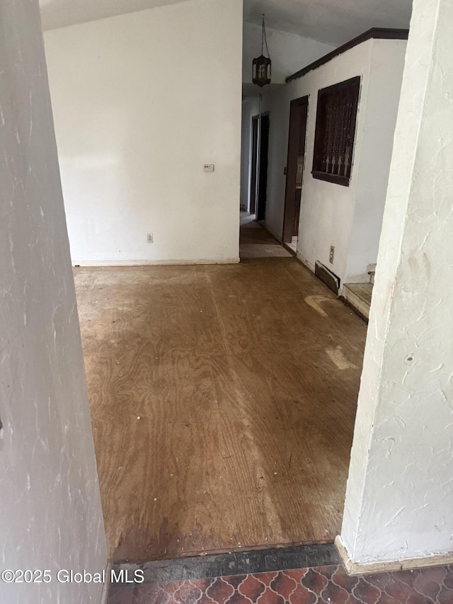 63 Ormond St, Albany, NY 12203 - unfurnished room featuring vaulted ceiling and a baseboard heating unit