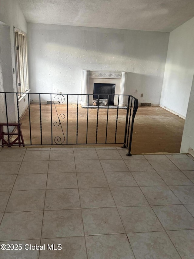 63 Ormond St, Albany, NY 12203 - empty room featuring tile patterned flooring and a fireplace