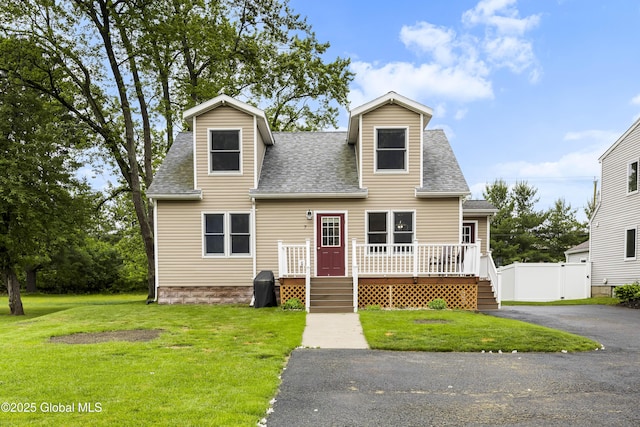 7 Camp Ter, Guilderland, NY 12203 - cape cod home with roof with shingles, a deck, and asphalt driveway