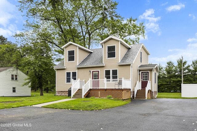 7 Camp Ter, Guilderland, NY 12203 - cape cod-style house with a shingled roof, a front yard, and driveway