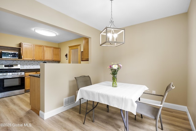 7 Camp Ter, Guilderland, NY 12203 - dining area with a chandelier and light wood finished floors