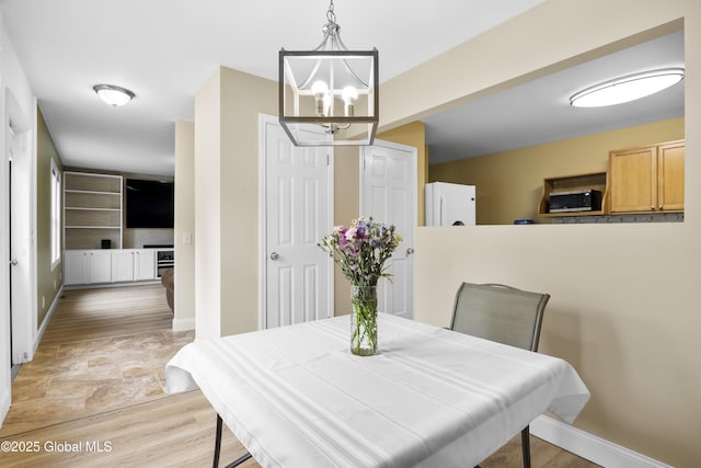 7 Camp Ter, Guilderland, NY 12203 - dining area featuring a chandelier and baseboards