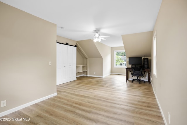 7 Camp Ter, Guilderland, NY 12203 - additional living space featuring a ceiling fan, light wood finished floors, a barn door, and vaulted ceiling