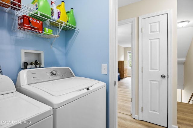 7 Camp Ter, Guilderland, NY 12203 - laundry room with light wood-style floors and separate washer and dryer