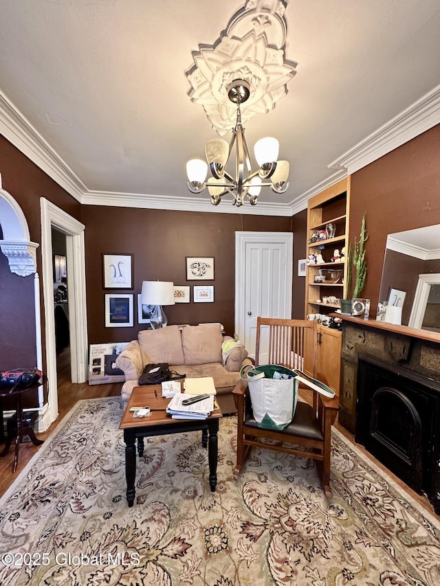 369 Madison Ave, Albany, NY 12210 - living room with wood finished floors, a chandelier, crown molding, and a fireplace