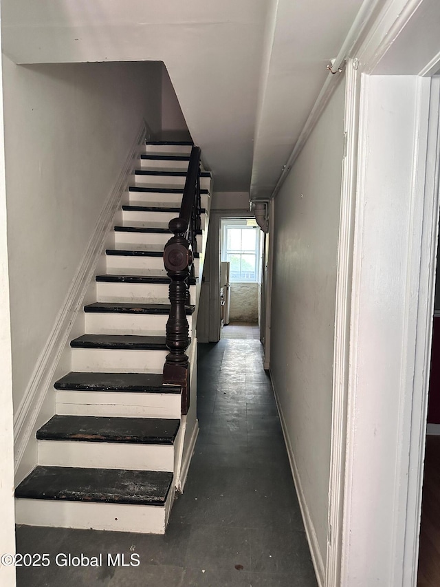 369 Madison Ave, Albany, NY 12210 - staircase with concrete flooring and baseboards