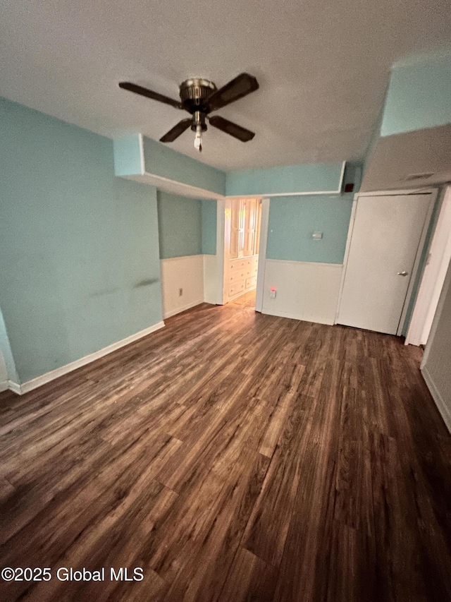369 Madison Ave, Albany, NY 12210 - unfurnished bedroom featuring wood finished floors, a textured ceiling, baseboards, and ceiling fan