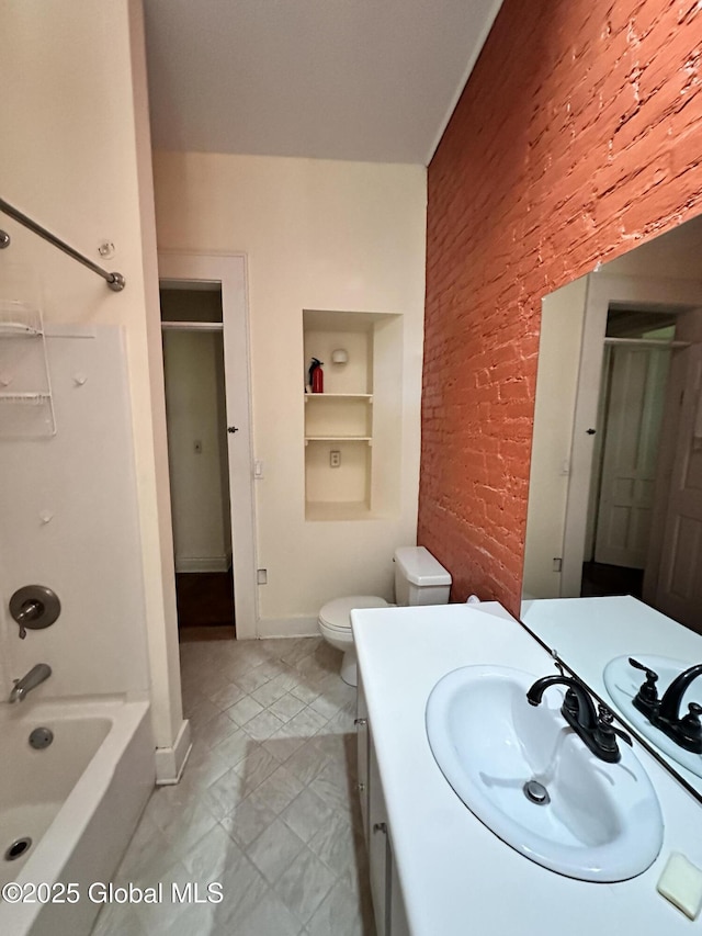 369 Madison Ave, Albany, NY 12210 - bathroom with built in shelves, vanity, brick wall, toilet, and shower / washtub combination