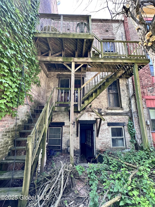 369 Madison Ave, Albany, NY 12210 - rear view of property with stairs and brick siding